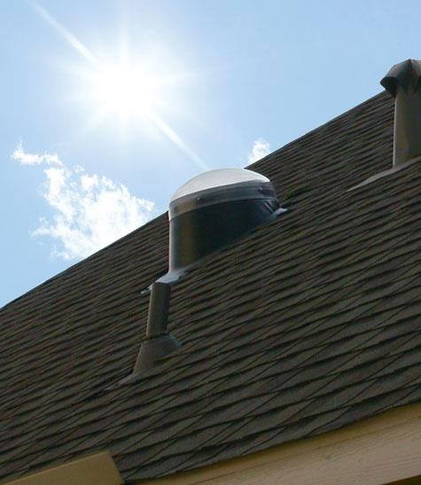 Circular skylight on the roof of a home in Michigan