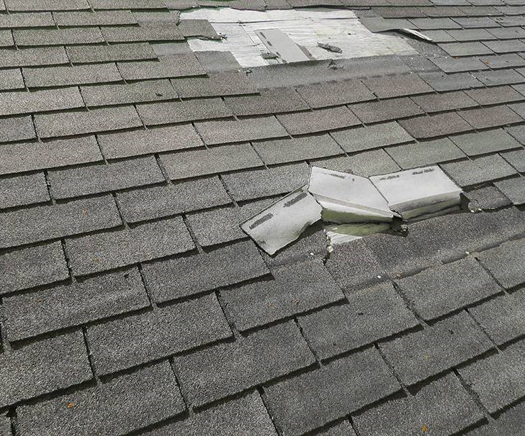 Roof damaged by wind and hail